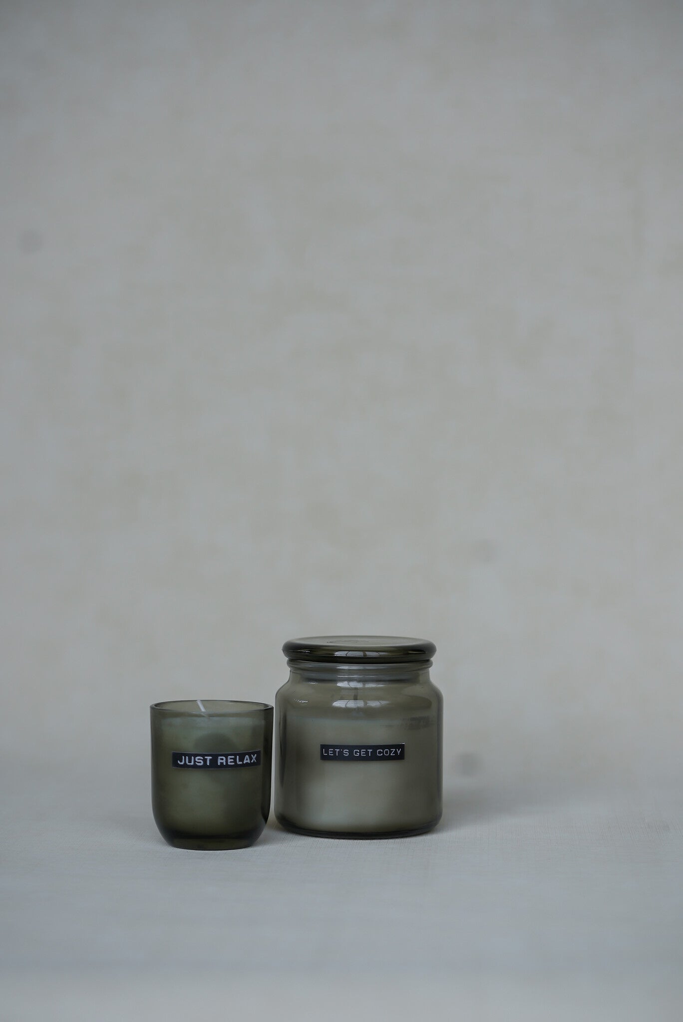 Wellmark - big scented candle smokey black - let's get cozy