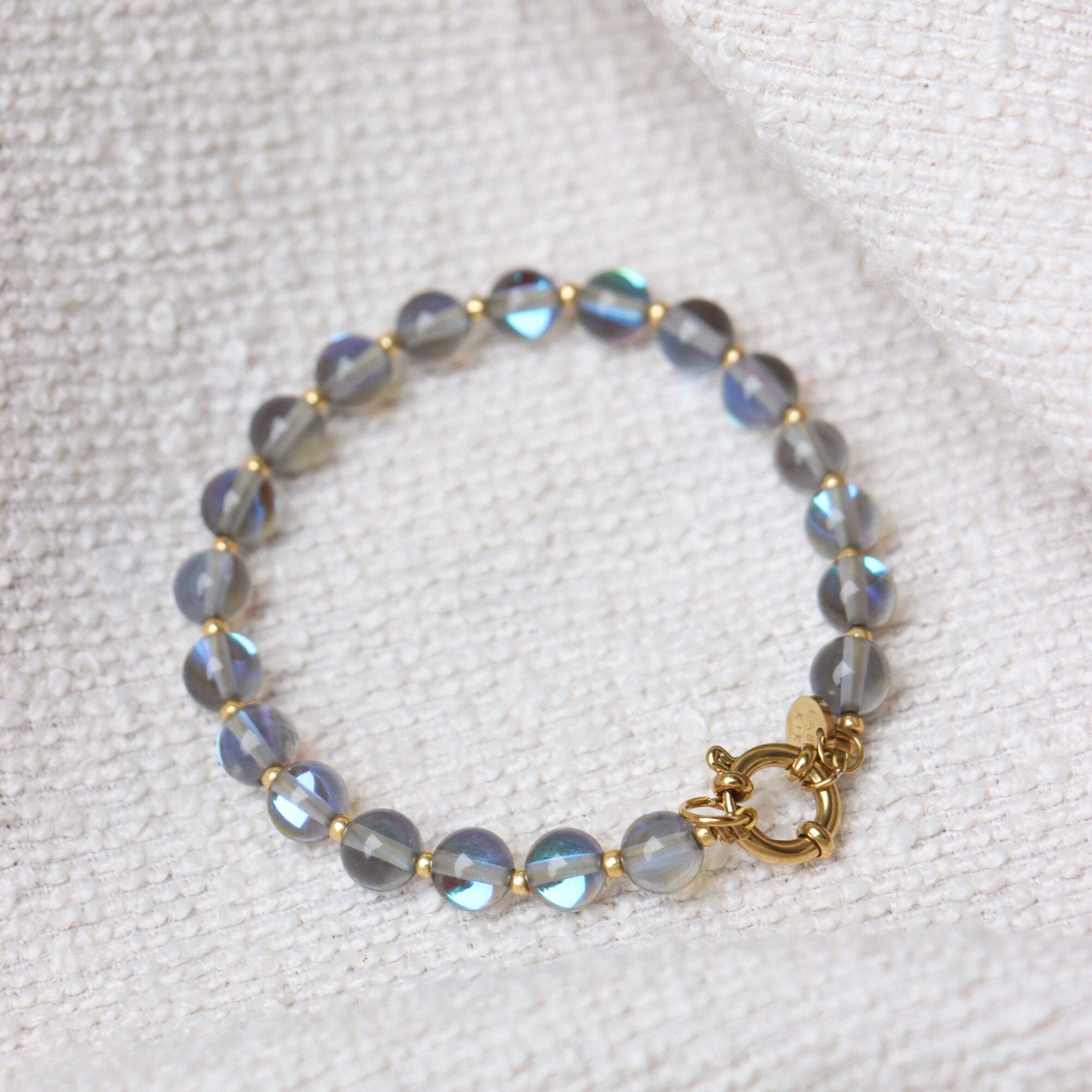 Label Kiki - grey flame bracelet gold